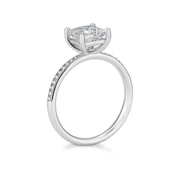 Verlobungsring mit einem Princess - Cut und 18 Brillanten 0,689 ct., Weißgold